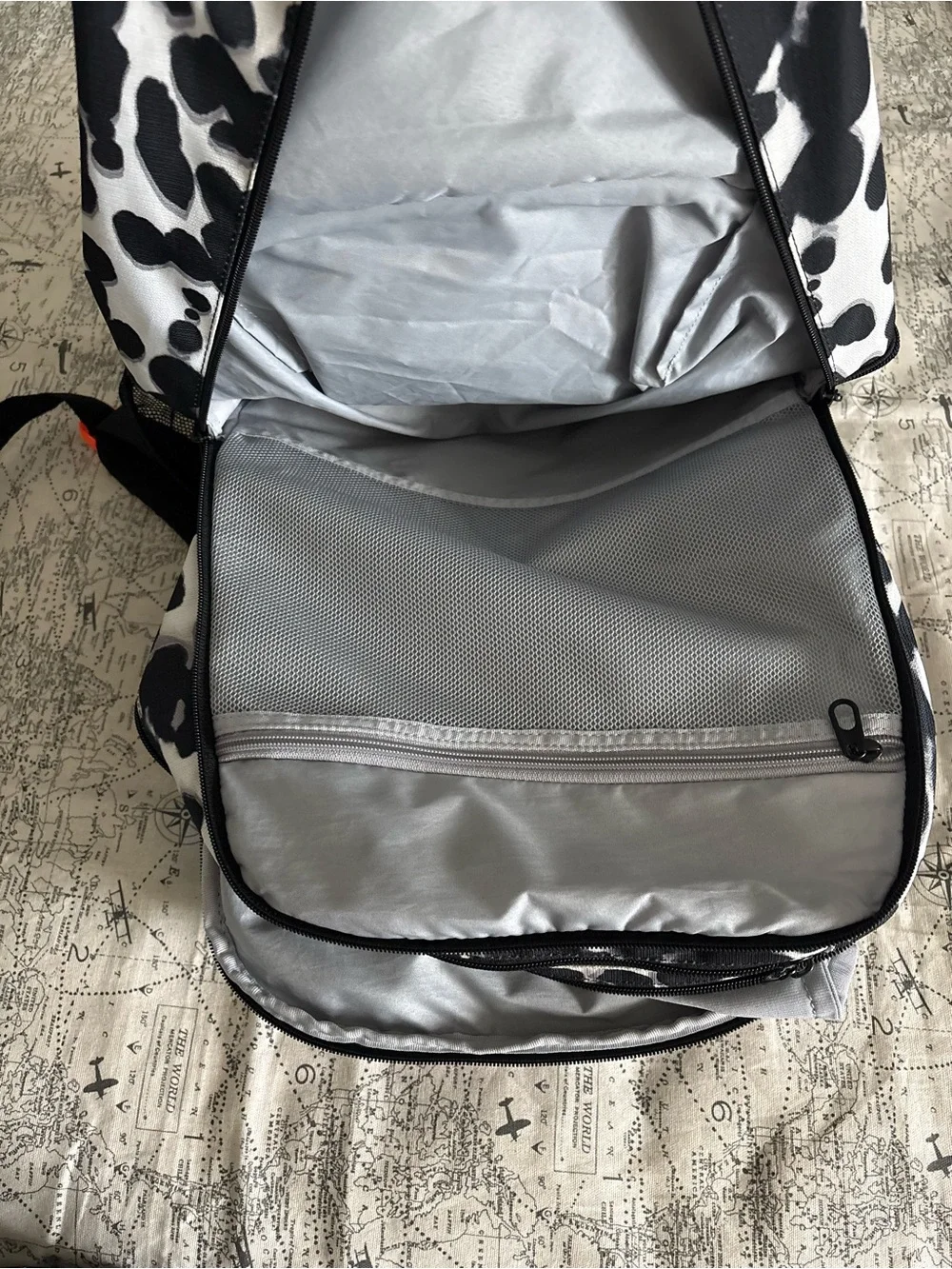 Nike Black and White Spot Pattern Backpack with Orange Swoosh